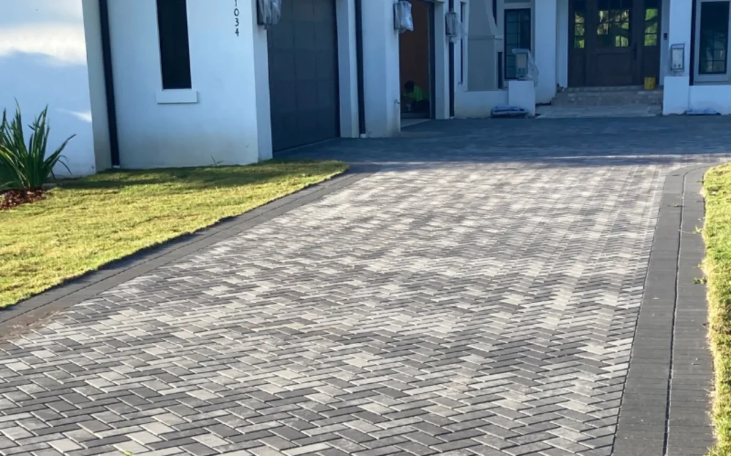 Durable concrete paths and walkways installation with a smooth broom finish, enhancing curb appeal for residential property in Boston, MA by Boston Concrete Work