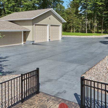 Durable residential concrete driveways installed and warrantied by Boston Concrete Work, offering superior longevity compared to asphalt in Boston, MA